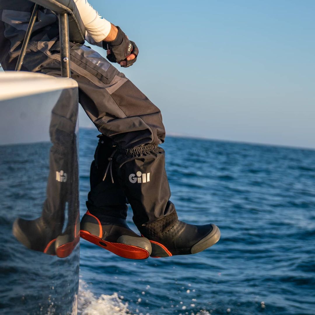 A sailor wearing the Offshore Boots while out at sea.